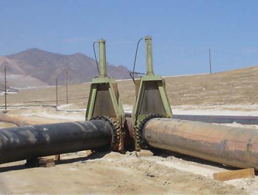In a tailings system, spigot pipes tee off the main tailing distribution line to feed various sections of the containment area. Each spigot features an isolation valve to control the flow of tailings to a specific zone, ensuring the material is uniformly distributed across the containment surface. Photo: Emerson