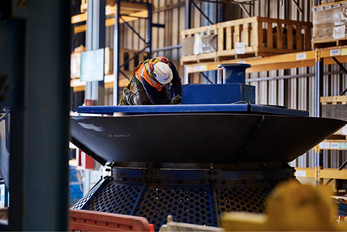 There is growing interest in structured rebuild programs, such as rebuild + upgrade combinations, lifecycle-based contracting, and fleet-wide condition assessments. Pictured: an FLS technician works on a WEMCO flotation cell.
