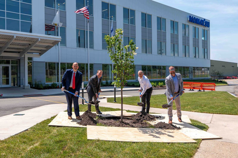 A ceremonial tree planting was held during the Peoria grand opening to mark Komatsu’s continued investment in the region and commitment to sustainable growth. Pictured from left: Mark Denzler, Illinois Manufacturers Association; Dan Funcannon and Peter Salditt, Komatsu; and Nick Hart, P.J. Hoerr.
